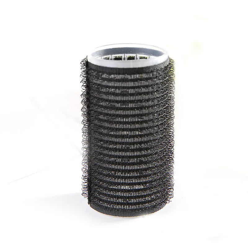 Black curling barrel made of plastic and resin measuring 3x6.3cm