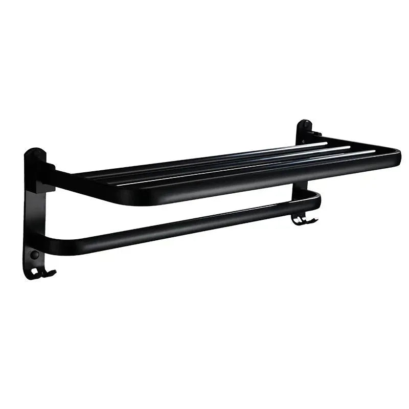 Aluminium double-layer folding shelf mounted on a bathroom wall with towels.