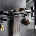 Aluminium double-layer folding shelf mounted on a bathroom wall with towels.