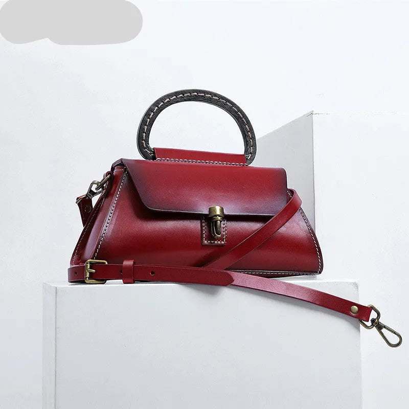 Women's genuine leather handbag with first layer cowhide, plain design, single strap, in yellow-brown, green or red.