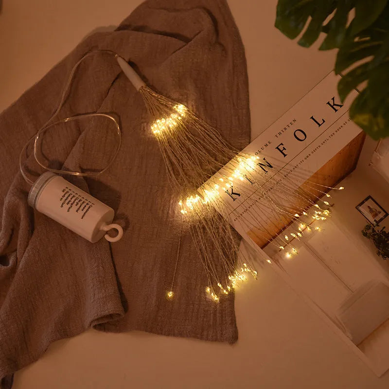 Solar-powered firework style LED meteor shower light hanging outdoors