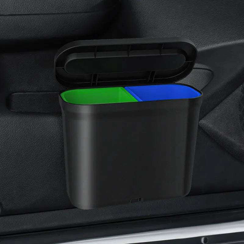 Black 1.7L PP plastic car trash can suspended on centre console with lid open, interior visible