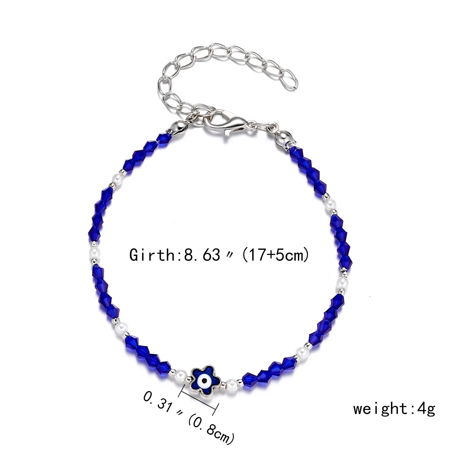 Handmade black string bracelet with evil eye charm and blue beads on a white background