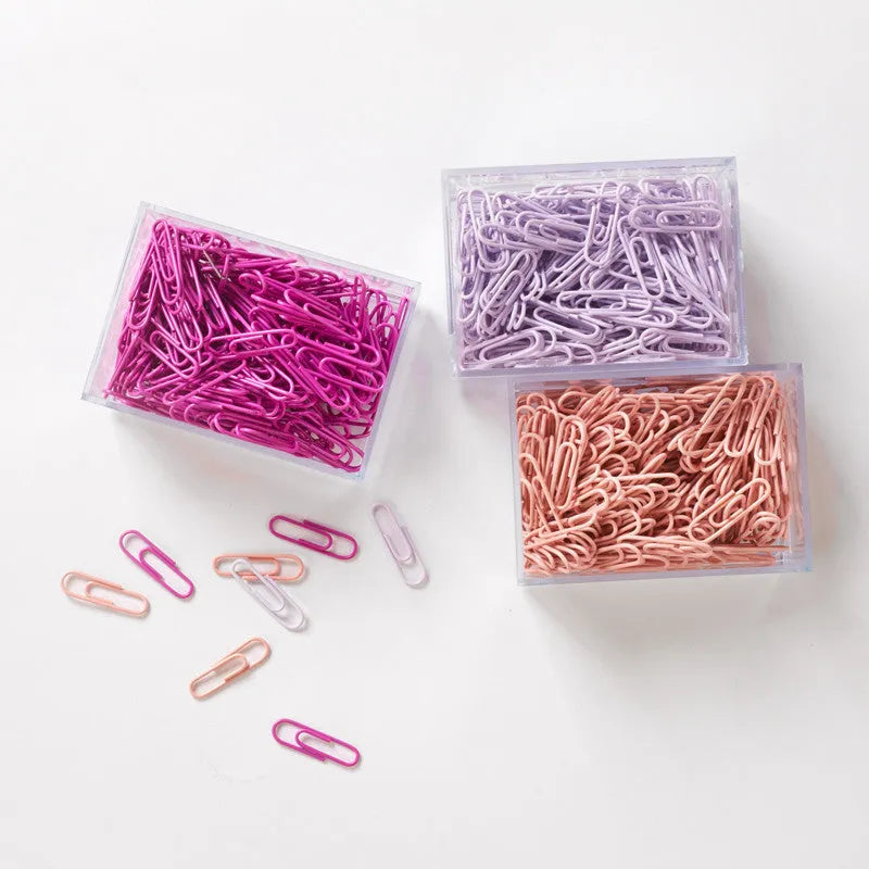 Mint green PVC coated metal paper clips in 28mm and 50mm sizes on white background