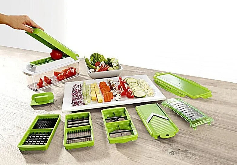 Green handheld manual food chopper with stainless steel blades on a white background.