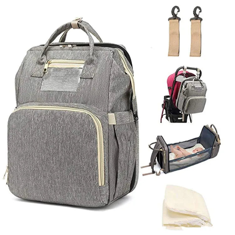 Large shell-shaped polyester mummy bag in black with three shoulder straps and soft handle