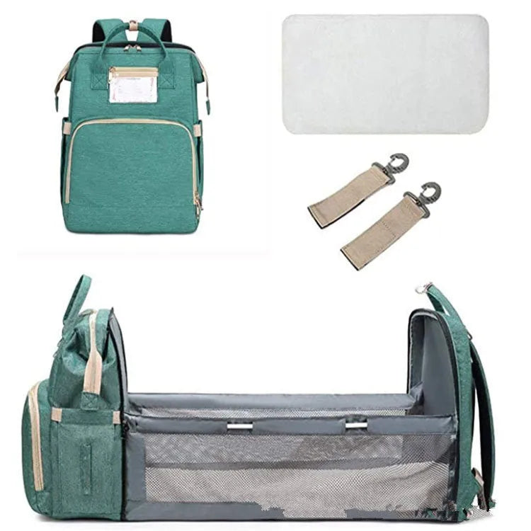 Large shell-shaped polyester mummy bag in black with three shoulder straps and soft handle