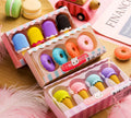 Set of 12 colourful cartoon food erasers including ice cream cones, donuts, and lollipops for children