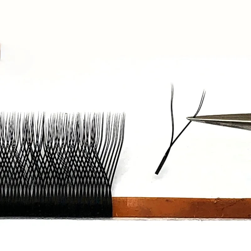 YY semi-finished eyelashes 3D flowering imported fiber lash extensions on a tray with multiple curl and length options