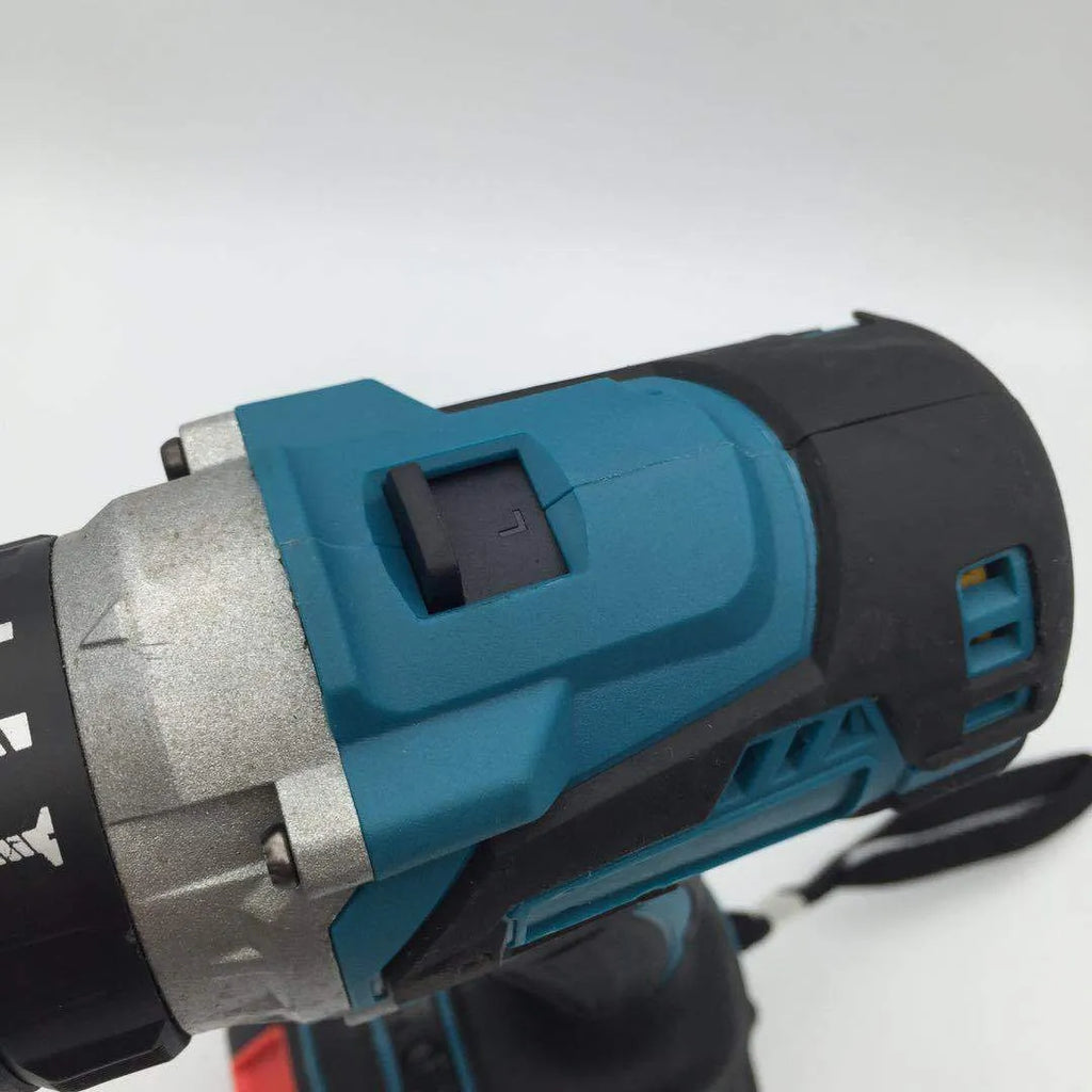 21V black and orange cordless impact drill with lithium battery on a workbench with drill bits