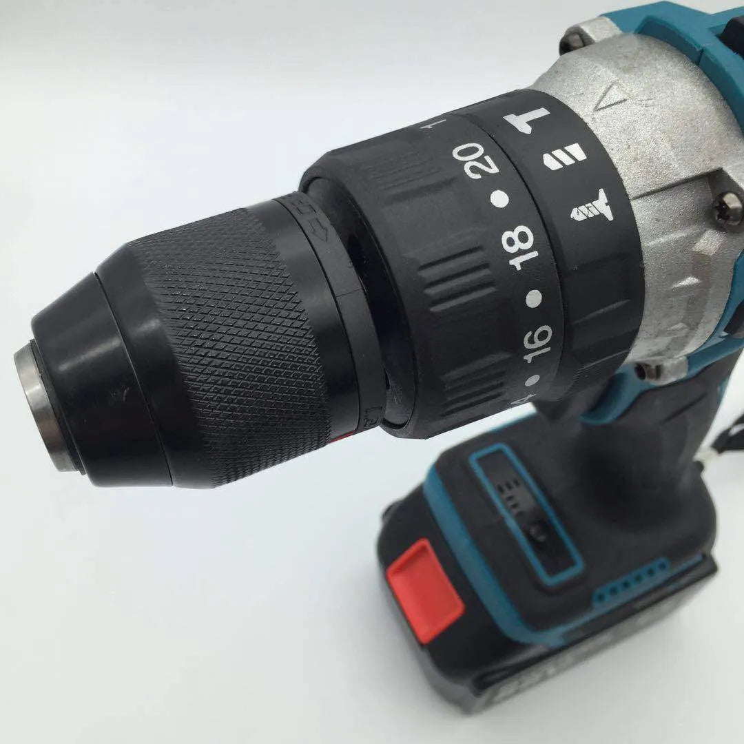 21V black and orange cordless impact drill with lithium battery on a workbench with drill bits