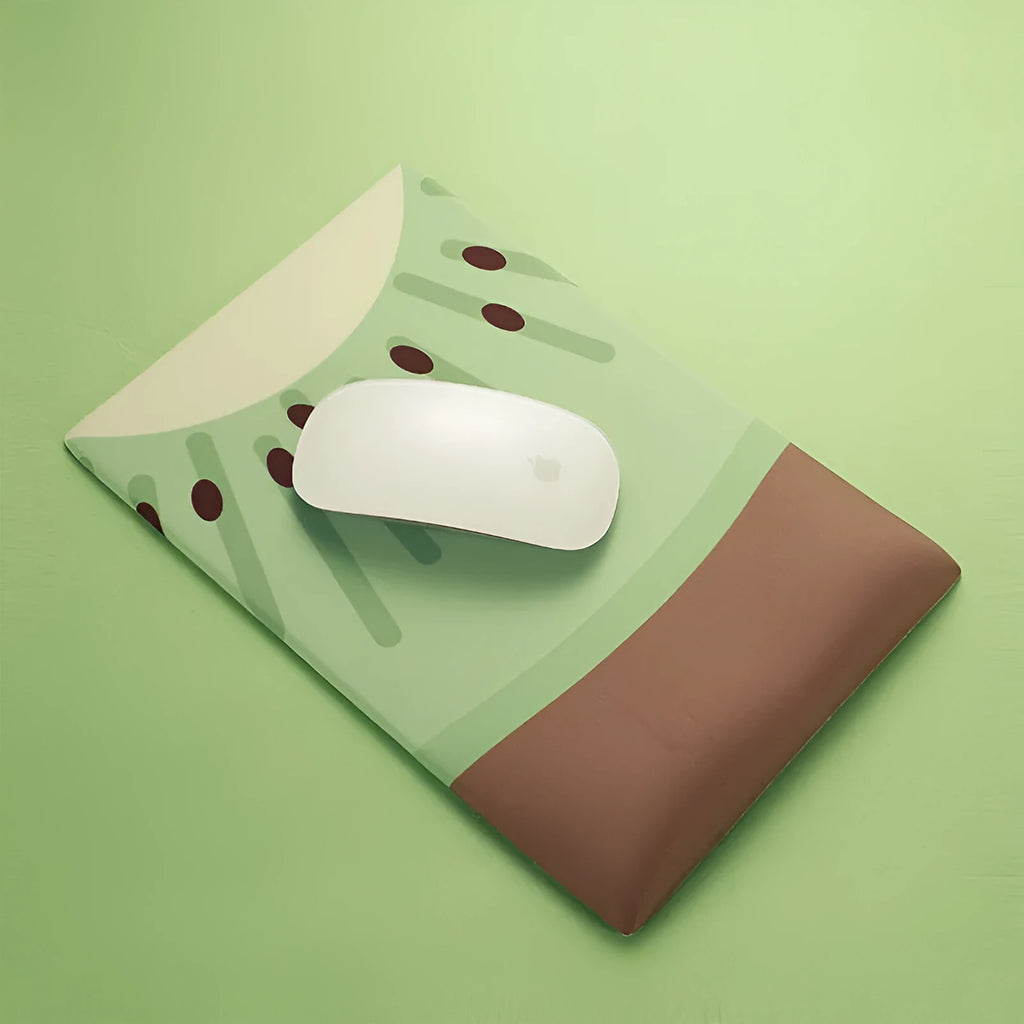Green kiwi fruit printed on large cloth mouse pad with a raised grey silicone wrist support attached.