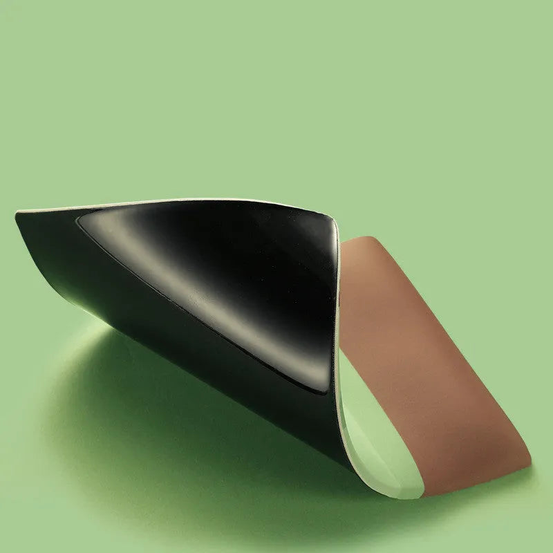 Green kiwi fruit printed on large cloth mouse pad with a raised grey silicone wrist support attached.