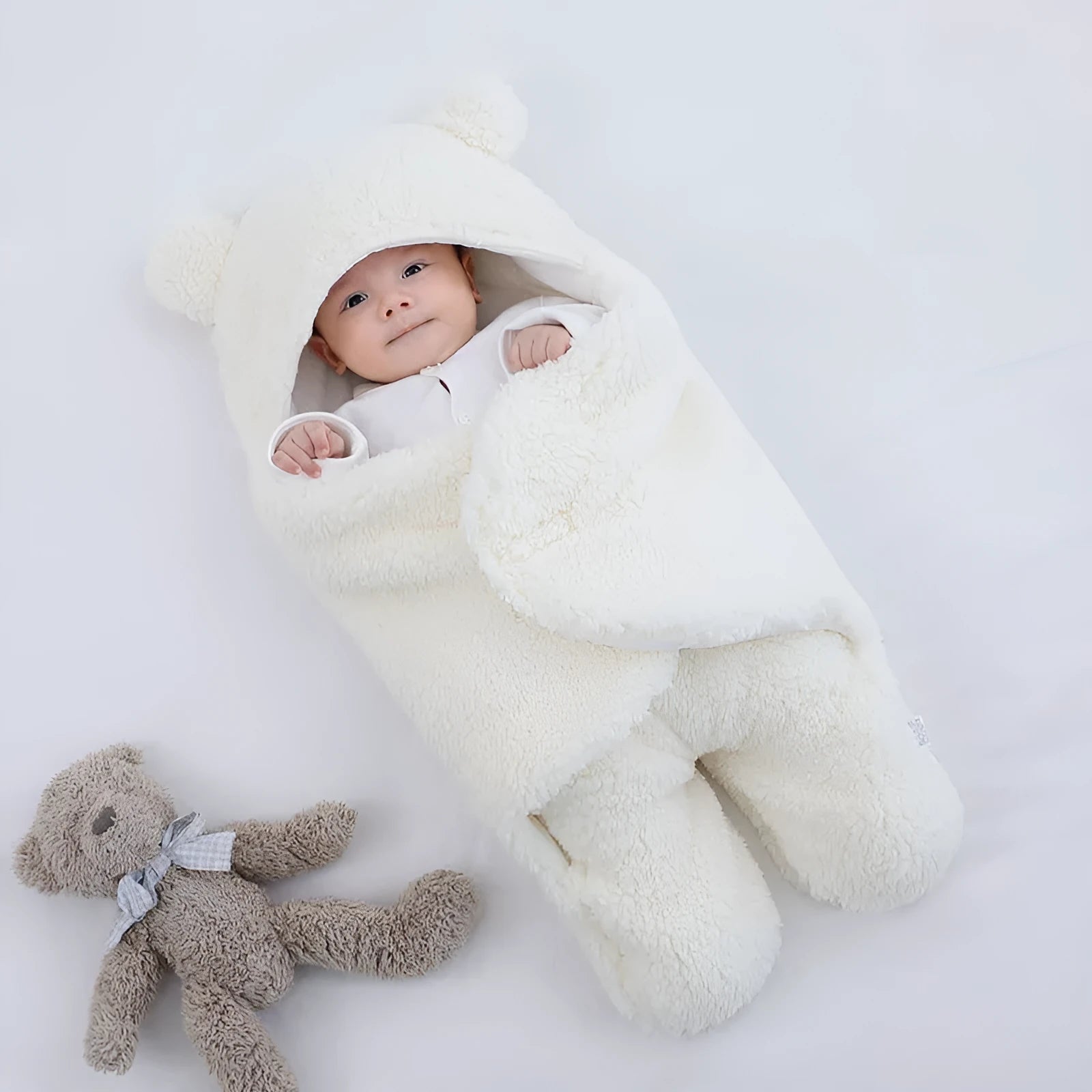 Cotton blend baby quilted sleeping bag wrapper shown in light blue, with size and colour options displayed.