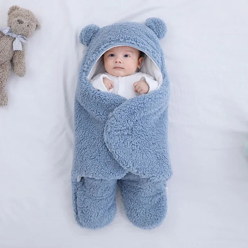 Cotton blend baby quilted sleeping bag wrapper shown in light blue, with size and colour options displayed.