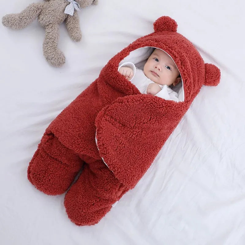 Cotton blend baby quilted sleeping bag wrapper shown in light blue, with size and colour options displayed.