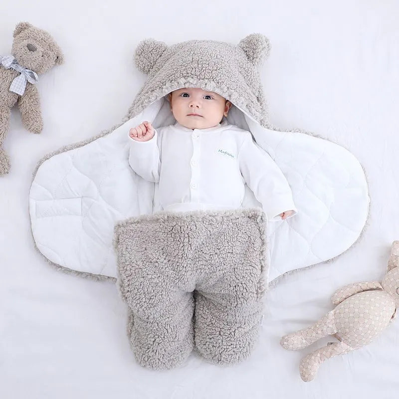 Cotton blend baby quilted sleeping bag wrapper shown in light blue, with size and colour options displayed.
