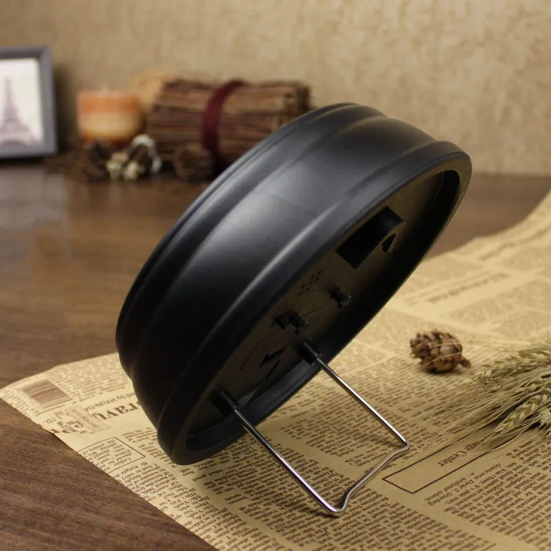 Round 6-inch European retro desk alarm clock with a plastic shell and pointer display.