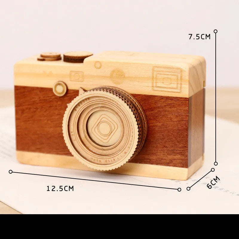 Camera-shaped wooden music box with rotating mechanism in pine construction