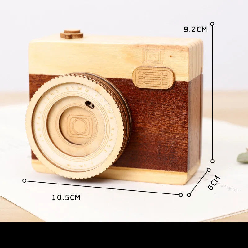 Camera-shaped wooden music box with rotating mechanism in pine construction