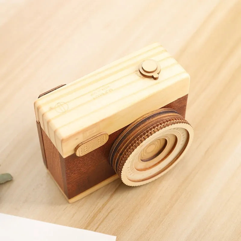Camera-shaped wooden music box with rotating mechanism in pine construction