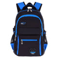 Green waterproof nylon school backpack for primary students with multiple compartments.