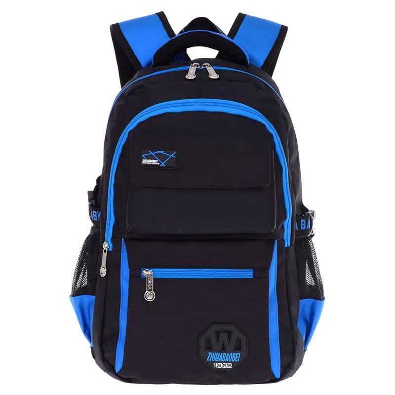Green waterproof nylon school backpack for primary students with multiple compartments.
