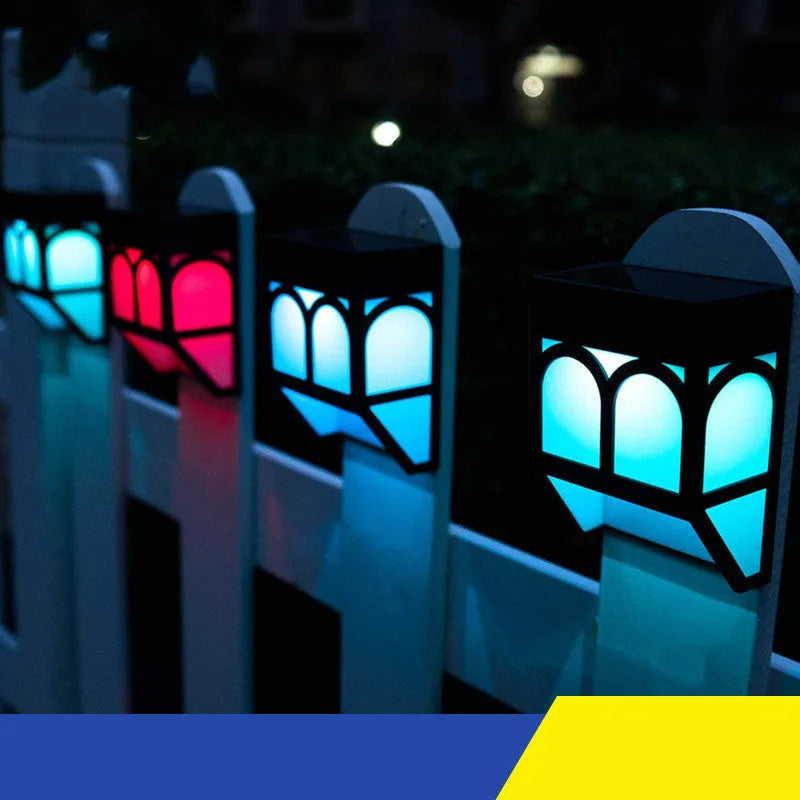 Solar wall lamp mounted on outdoor fence with IP67 waterproof rating and compact 90x122mm dimensions
