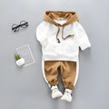 Child's blue two-piece hooded tracksuit set with top and trousers on white background