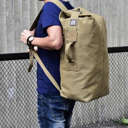 Canvas outdoor climbing backpack in khaki large size with double shoulder straps and car-suture detailing