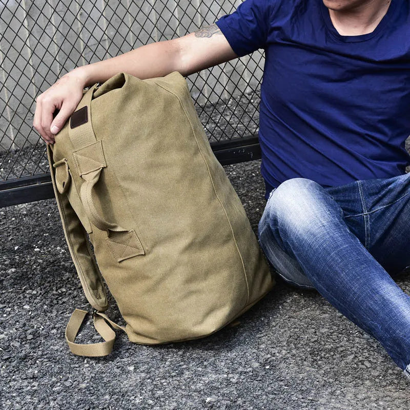 Canvas outdoor climbing backpack in khaki large size with double shoulder straps and car-suture detailing
