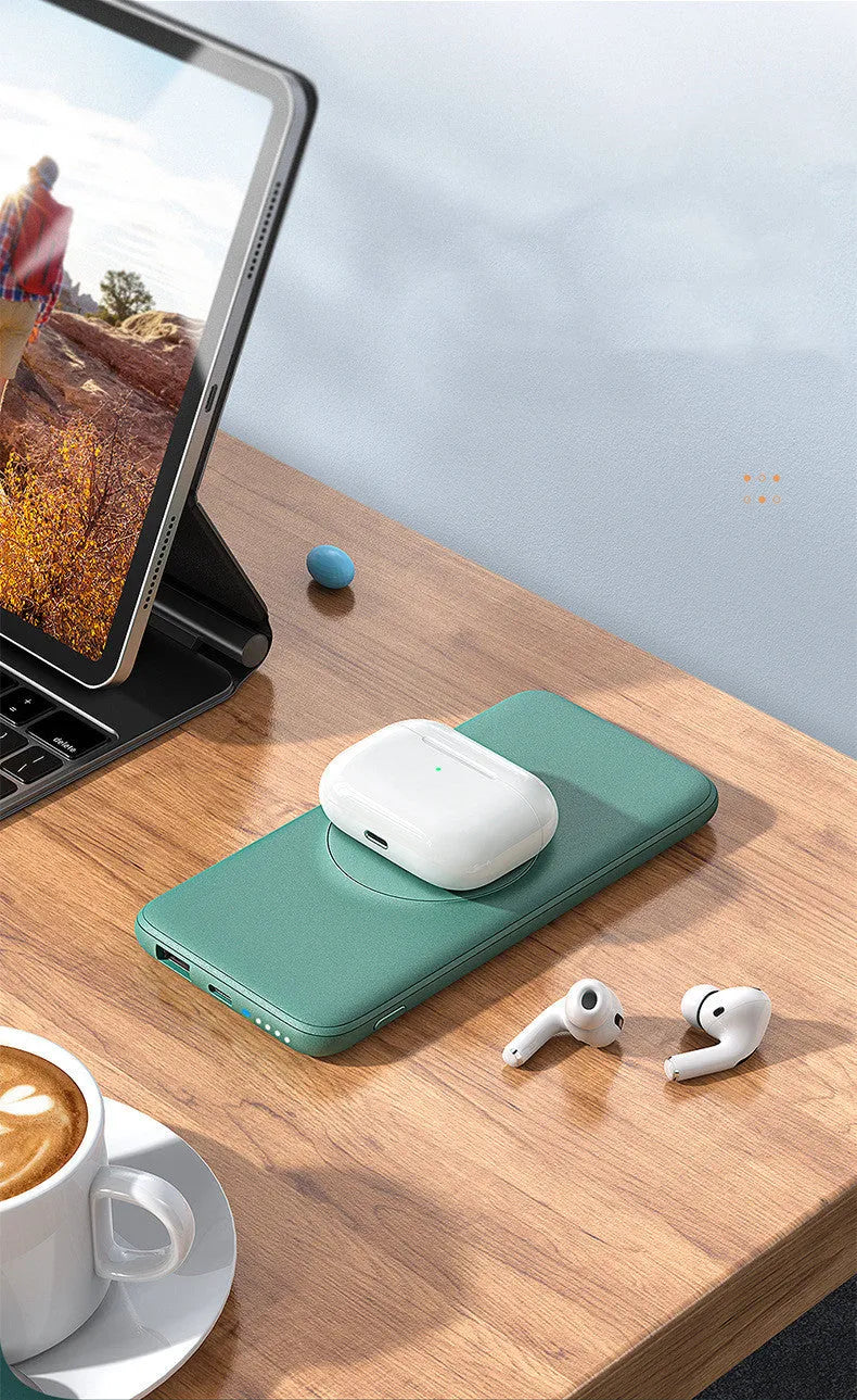 Maiduo mint green magnetic wireless power bank clipped to a bag, showing slim profile and MagSafe attachment to an iPhone.
