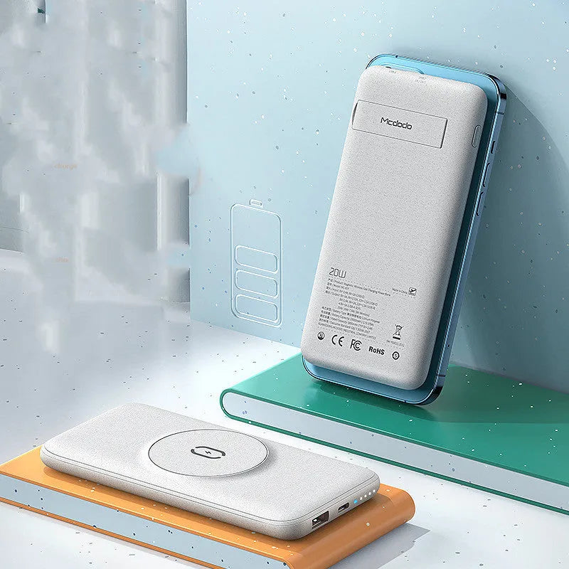 Maiduo mint green magnetic wireless power bank clipped to a bag, showing slim profile and MagSafe attachment to an iPhone.