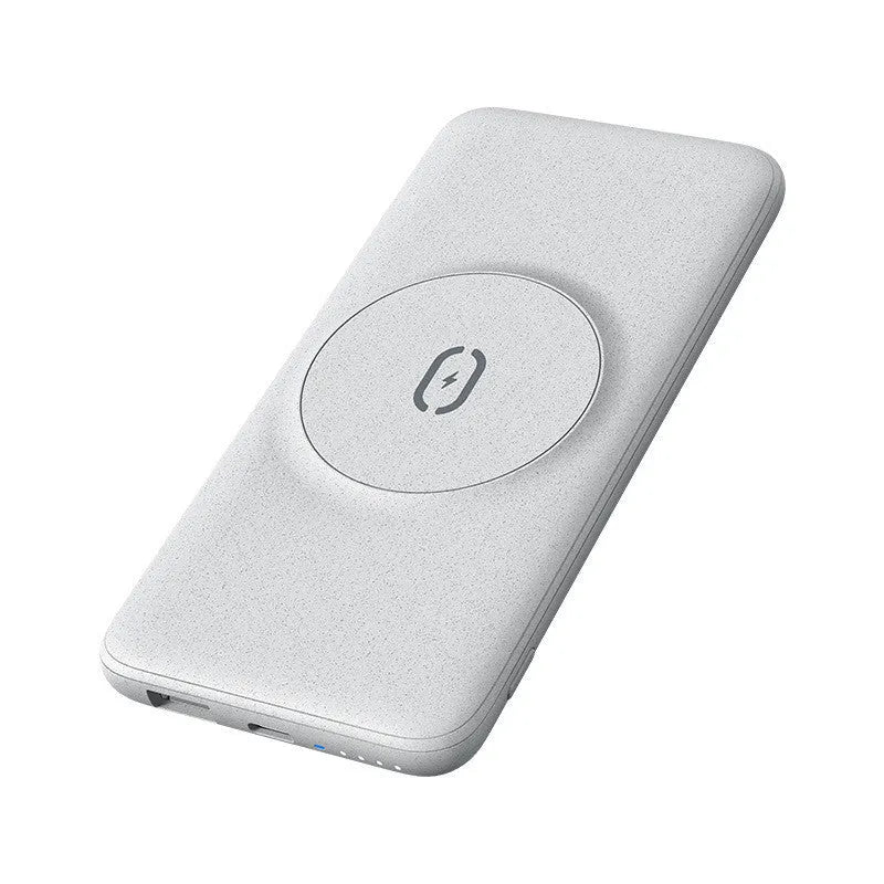 Maiduo mint green magnetic wireless power bank clipped to a bag, showing slim profile and MagSafe attachment to an iPhone.