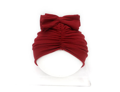 Soft knitted acrylic baby girl turban hat in various colours fitting 0-28 months