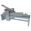 Fixed angle sharpening tool for woodworking chisels and carving knives on a workbench.