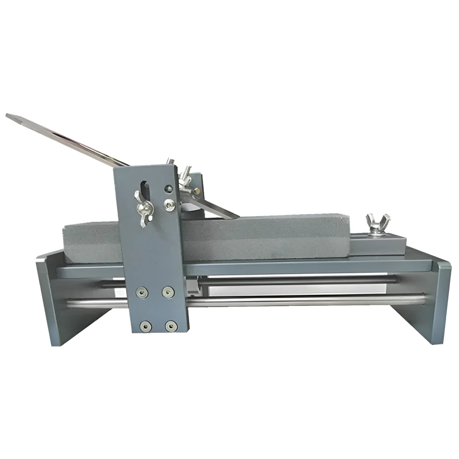 Fixed angle sharpening tool for woodworking chisels and carving knives on a workbench.
