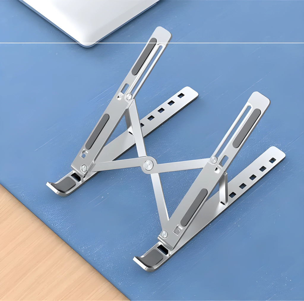 Aluminium alloy laptop heightening bracket folded flat on desktop, black colour, with portable storage base lifter design.