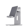 Dark Space Gray alloy mobile phone holder with adjustable arm holding a smartphone on a wooden desk.