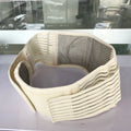 Black self-heating magnetic waist support belt fastened around a waist, showing adjustable straps and elastic cloth material.