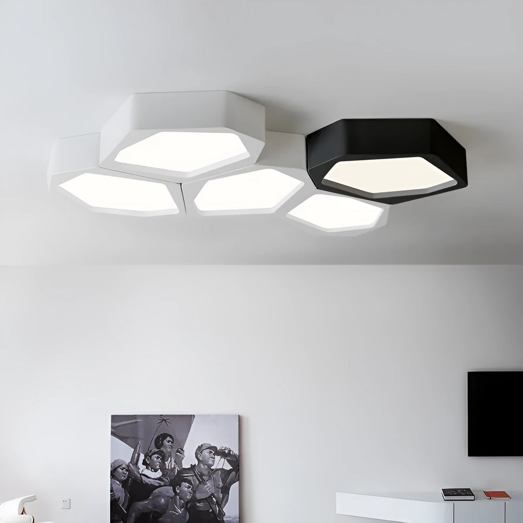Modern geometric-shaped iron wall light with remote control on a living room wall.