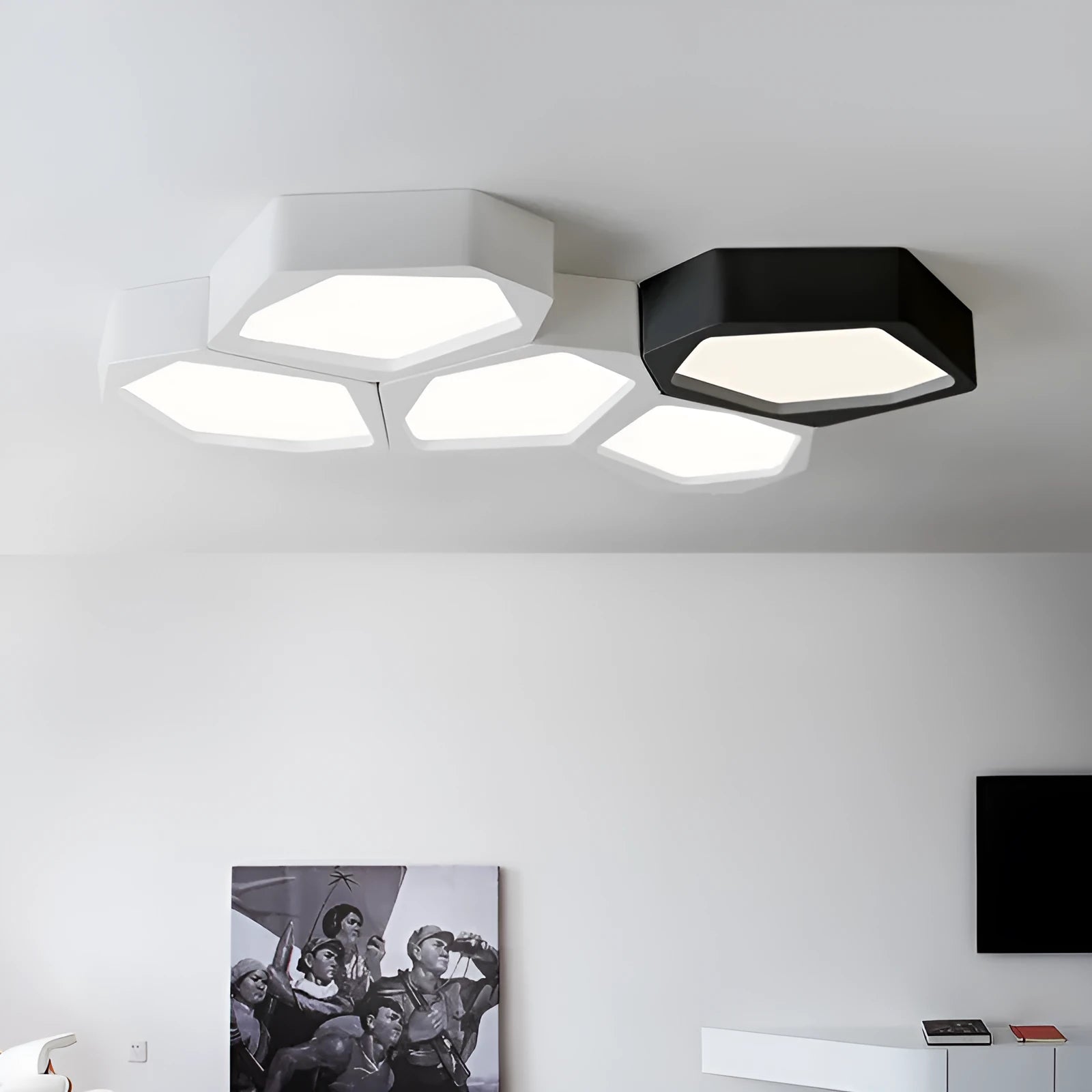 Modern geometric-shaped iron wall light with remote control on a living room wall.
