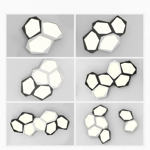 Modern geometric-shaped iron wall light with remote control on a living room wall.