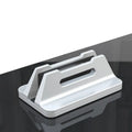 Silver aluminium alloy vertical notebook storage bracket on desk holding a laptop upright