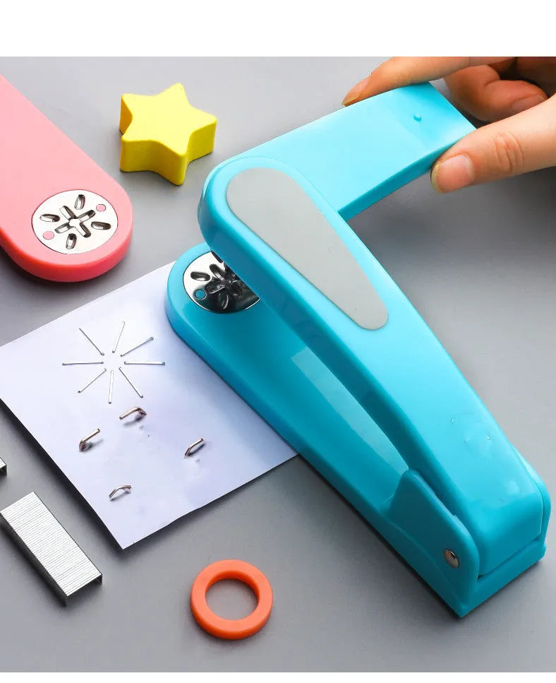 Black 360-degree rotatable stapler on a stack of A4 paper, showing its rotating head mechanism.