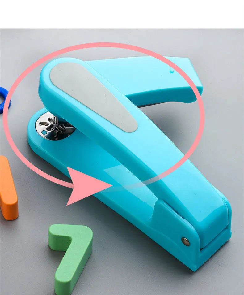 Black 360-degree rotatable stapler on a stack of A4 paper, showing its rotating head mechanism.