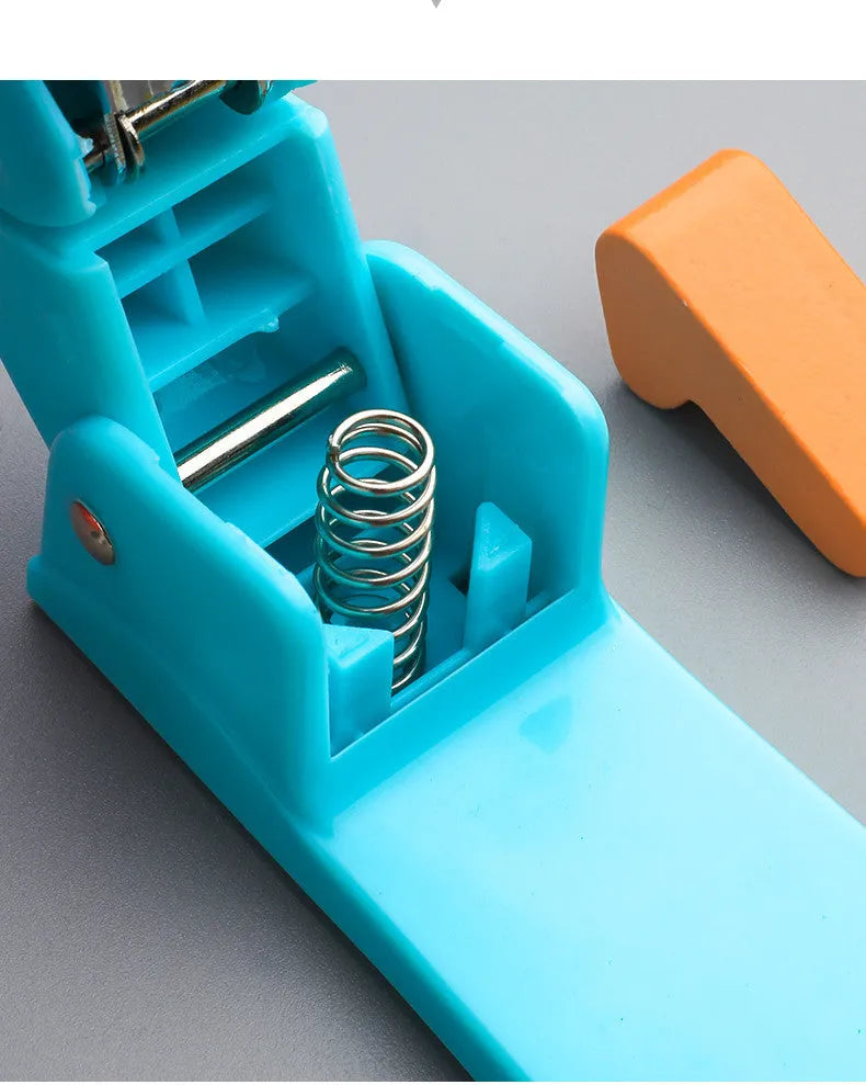 Black 360-degree rotatable stapler on a stack of A4 paper, showing its rotating head mechanism.