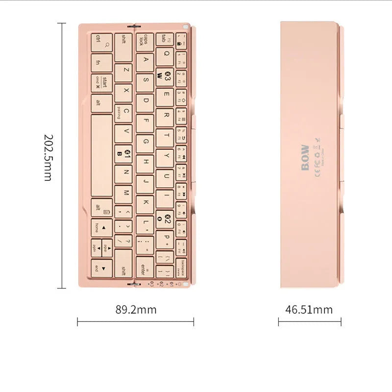 Silver white aluminium folding Bluetooth keyboard shown open next to a smartphone propped on its hidden stand.