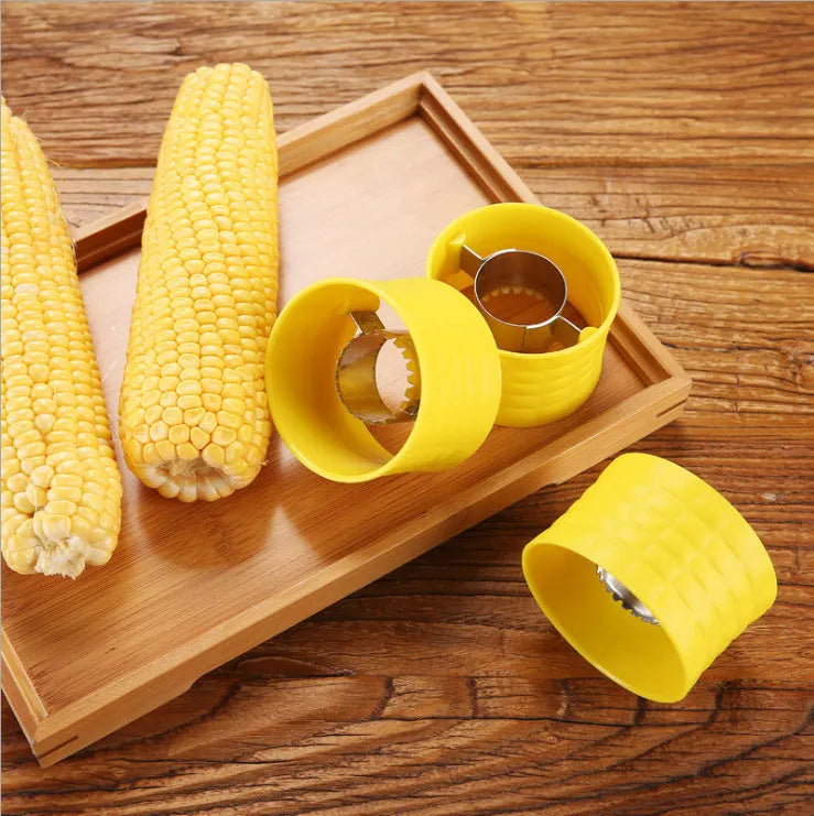 Yellow manual corn grinder thresher with corn-shaped plastic body and stainless steel peeling gear
