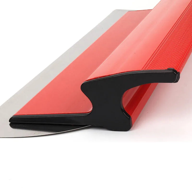 Grey handle leveling scraper tool with a long 40cm steel blade for wall preparation.